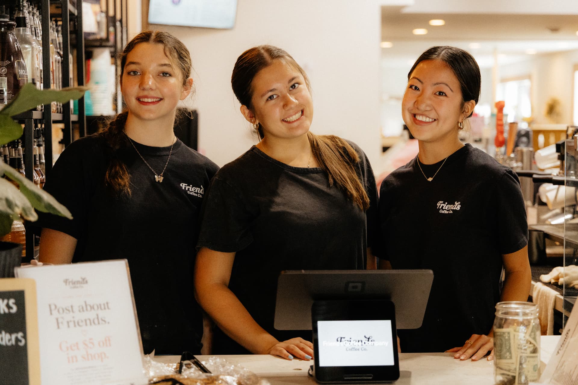 Friends Coffee Co. team behind the counter