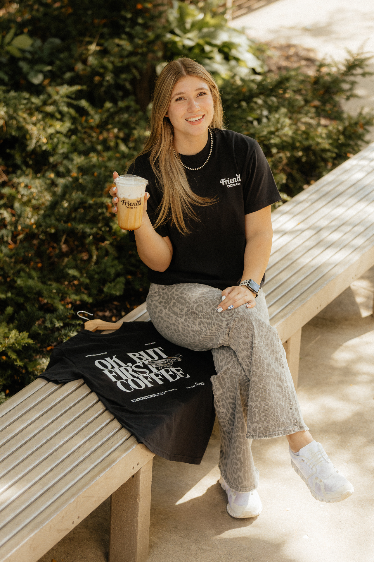 A team member in a Friends Coffee Co. tee